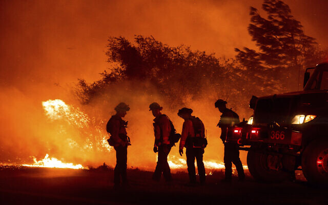 Firefighters monitor the Bear Fire burning in Oroville, California on Sept. 9, 2020 (AP Photo/Noah Berger)