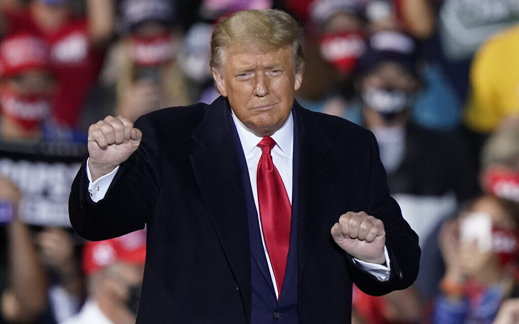 US President Donald Trump dances with the music after speaking at a campaign rally, in Swanton, Ohio, September 21, 2020. (Tony Dejak/AP)