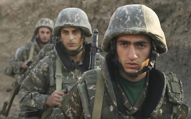 In this image taken from video released by the Armenian Defense Ministry on Wednesday, Sept. 30, 2020, Armenian solders guard their position in the self-proclaimed Republic of Nagorno-Karabakh, Azerbaijan.  (Armenian Defense Ministry via AP)