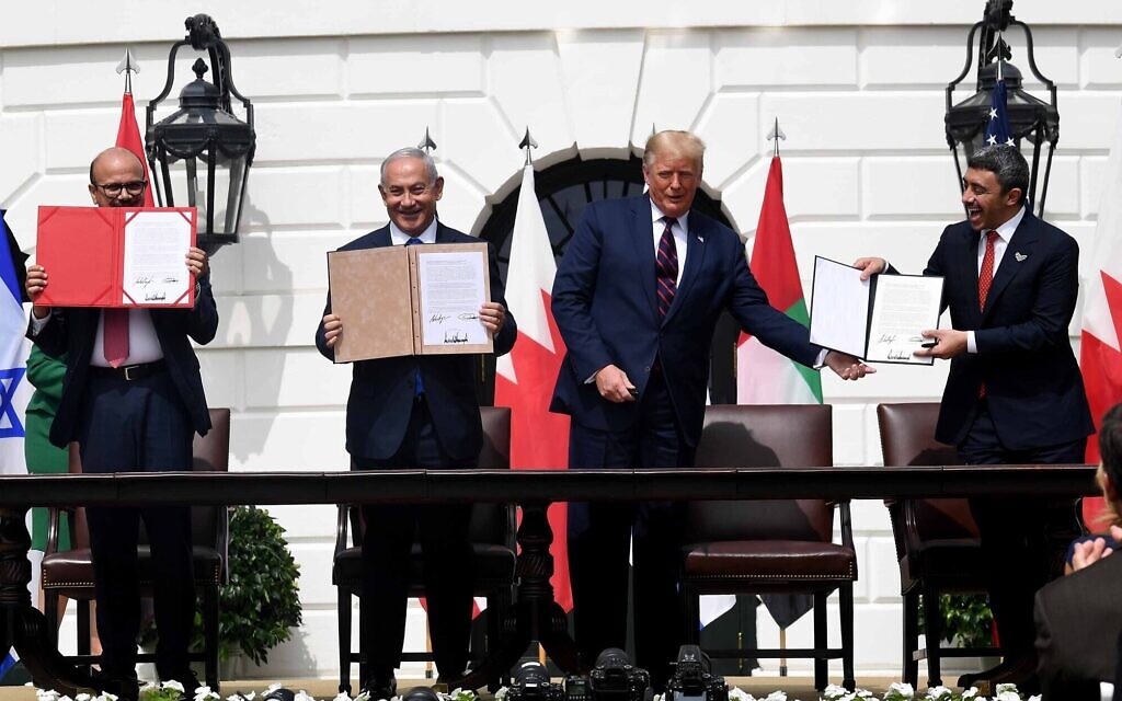 (L-R) Bahrain Foreign Minister Abdullatif al-Zayani, Israeli Prime Minister Benjamin Netanyahu, US President Donald Trump, and UAE Foreign Minister Abdullah bin Zayed Al-Nahyan hold up the documents they signed at the Abraham Accords ceremony where Bahrain and the United Arab Emirates recognized Israel, at the White House in Washington, DC, September 15, 2020. (Avi Ohayon / GPO)