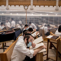 Yeshiva students study in separation capsules in Jerusalem on September 2, 2020. (Yonatan Sindel/Flash90)