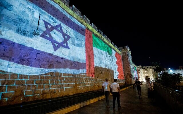 The flags of the US, United Arab Emirates, Israel and Bahrain are screened on the walls of Jerusalem's Old City, on September 15, 2020. (Yonatan Sindel/Flash90)