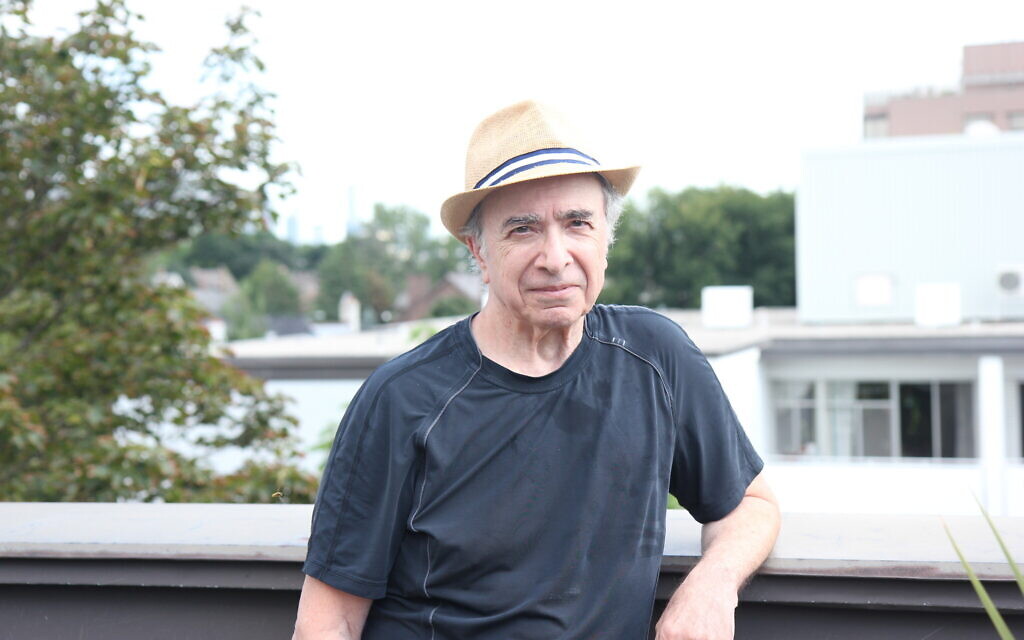 Michael Posner, author of 'Leonard Cohen, Untold Stories,' poses on the rooftop terrace of his apartment building in midtown Toronto, August 21, 2020. (Etye Sarner)