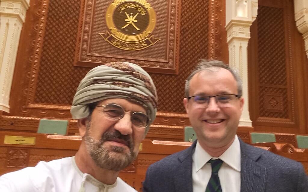 Sigurd Neubauer, right, with a senior Omani official at Oman's Consultative Assembly, Muscat 2019 (courtesy)