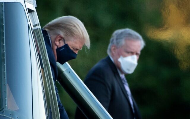 White House Chief of Staff Mark Meadows (R) watches as US President Donald Trump walks off Marine One while arriving at Walter Reed Medical Center in Bethesda, Maryland, on October 2, 2020. (Brendan Smialowski/AFP)