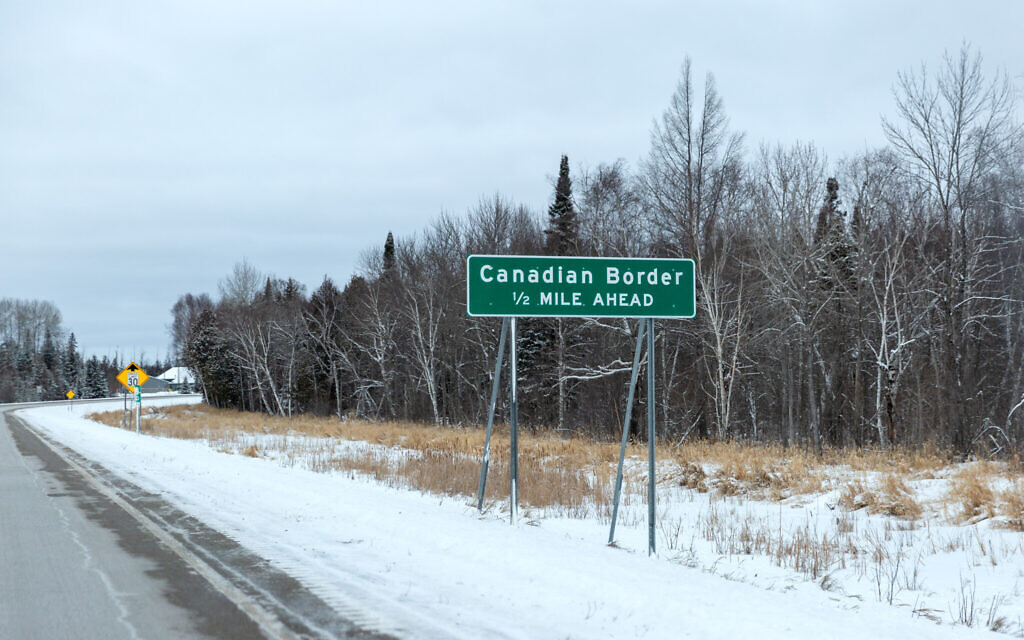 A sign marks the Canadian border. (Lorie Shaull/Flickr/ via JTA)