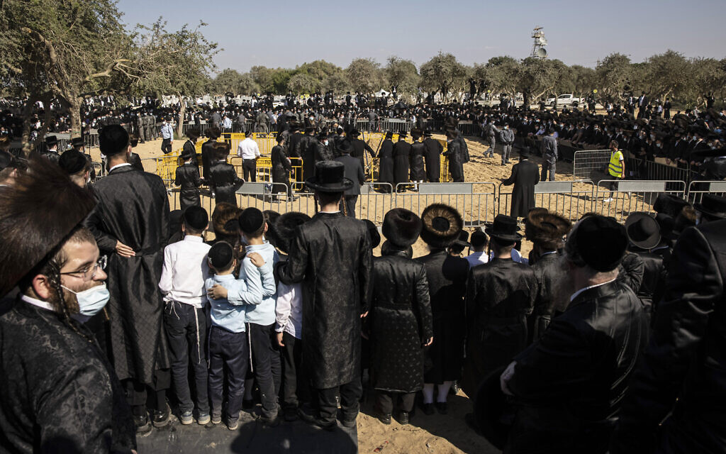 Large numbers of ultra-Orthodox Jews gather for the funeral for Rabbi Mordechai Leifer, in Ashdod, Israel, Monday, Oct. 5, 2020. (AP Photo/Tsafrir Abayov)