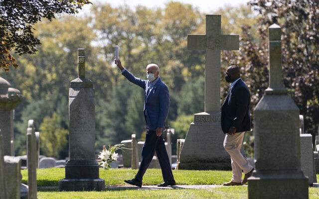 Democratic presidential candidate former Vice President Joe Biden waves to media as he leaves St. Joseph On the Brandywine Catholic Church after attending Mass in Wilmington, Delaware, Sept. 6, 2020. (AP Photo/Carolyn Kaster)