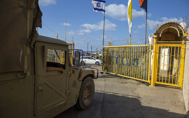 An Israeli soldier opens the gates of the Rosh Hanikra border crossing between Israel and Lebanon in northern Israel, on October 14, 2020. (Ariel Schalit/AP)