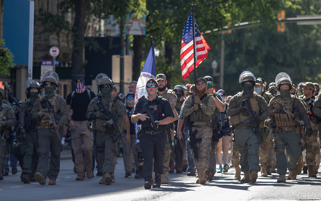 Armed gun rights protesters, led by a member of the far-right Boogaloo boys, march in Richmond, Virginia, Aug. 18, 2020. (Chad Martin/LightRocket via Getty Images, JTA)
