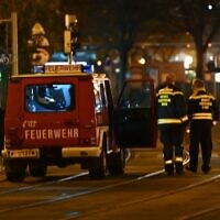 Firefighters and police cars stand near Schwedenplatz square following a shooting in the center of Vienna on November 2, 2020. (Joe Klamar / AFP)