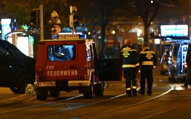 Firefighters and police cars stand near Schwedenplatz square following a shooting in the center of Vienna on November 2, 2020. (Joe Klamar / AFP)