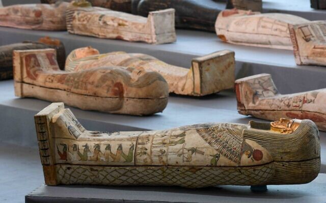 Wooden sarcophagi on display during the unveiling of an ancient treasure trove of more than a 100 intact sarcophagi, at the Saqqara necropolis 30 kms south of the Egyptian capital Cairo, on November 14, 2020 (Ahmed HASAN / AFP)