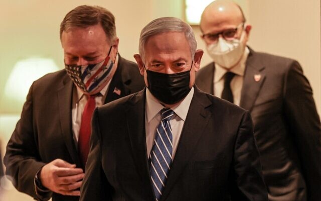 (L to R) US Secretary of State Mike Pompeo, Israeli Prime Minister Benjamin Netanyahu, and Bahrain's Foreign Minister Abdullatif bin Rashid Al Zayani, all mask-clad due to the COVID-19 coronavirus pandemic, arrive for a press conference after their trilateral meeting in Jerusalem on November 18, 2020. (Menahem KAHANA / POOL / AFP)