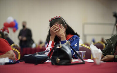 US President Donald Trump supporter Loretta Oakes reacts while watching returns in favor of Democratic presidential candidate former Vice President Joe Biden, at a Republican election-night watch party, November 3, 2020, in Las Vegas. (AP Photo/John Locher)