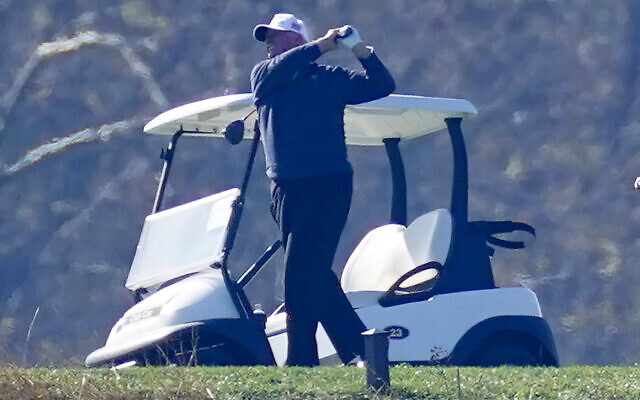 US President Donald Trump plays a round of golf, at the Trump National Golf Club in Sterling Virginia, November 8, 2020. (Steve Helber/AP)