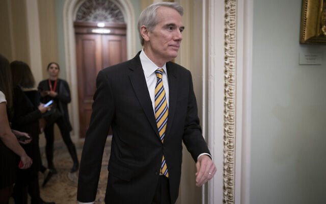 In this Jan. 31, 2020, file photo Sen. Rob Portman, R-Ohio, arrives as the impeachment trial of President Donald Trump on charges of abuse of power and obstruction of Congress resumes in Washington. (AP Photo/J. Scott Applewhite)