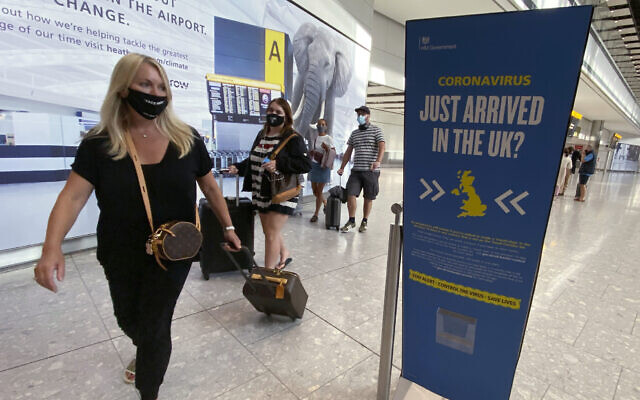 Passengers arrive at Heathrow Airport, September 8, 2020 (Yui Mok/PA via AP)