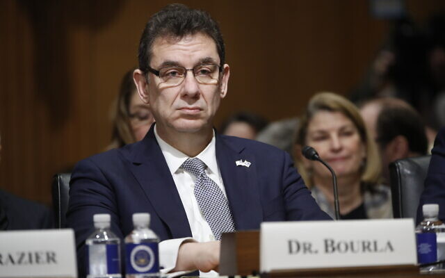 In this Tuesday, Feb. 26, 2019 file photo, Albert Bourla, chief executive officer of Pfizer, prepares to testify before the Senate Finance Committee on Capitol Hill in Washington. (AP Photo/Pablo Martinez Monsivais)