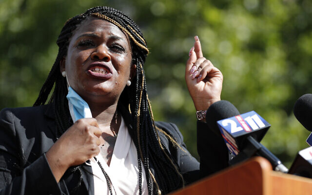 In this Aug. 5, 2020, file photo, Activist Cori Bush speaks during a news conference Wednesday, Aug. 5, 2020, in St. Louis. Bush is a Ferguson protester who is running for Congress. (AP Photo/Jeff Roberson, File)