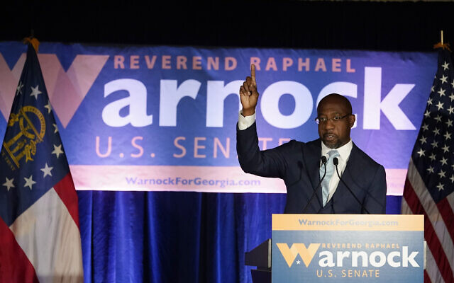 Raphael Warnock, a Democratic candidate for the US Senate, speaks during a rally on November 3, 2020, in Atlanta. (AP Photo/Brynn Anderson, Pool)