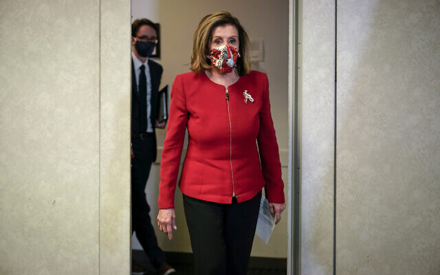 Speaker of the US House Nancy Pelosi, D-Calif., arrives to talk to reporters about Election Day results in races for the House of Representatives, at Democratic National Committee headquarters in Washington, Nov. 3, 2020. (AP Photo/J. Scott Applewhite, Pool)