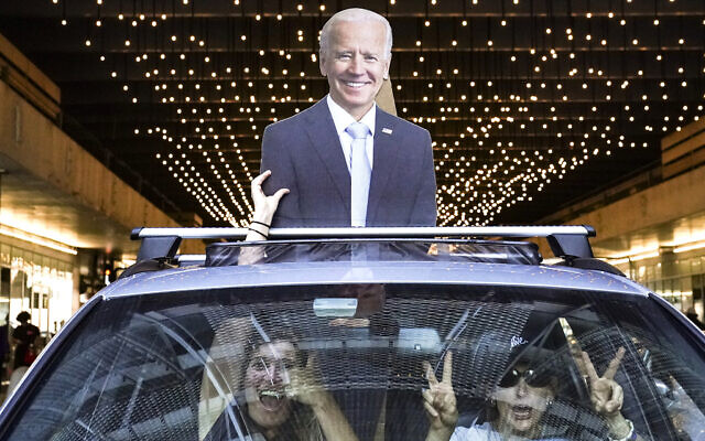 Motorists celebrate after the 2020 US presidential election is called for President-elect Joe Biden, November 7, 2020, in Philadelphia. (AP Photo/John Minchillo)