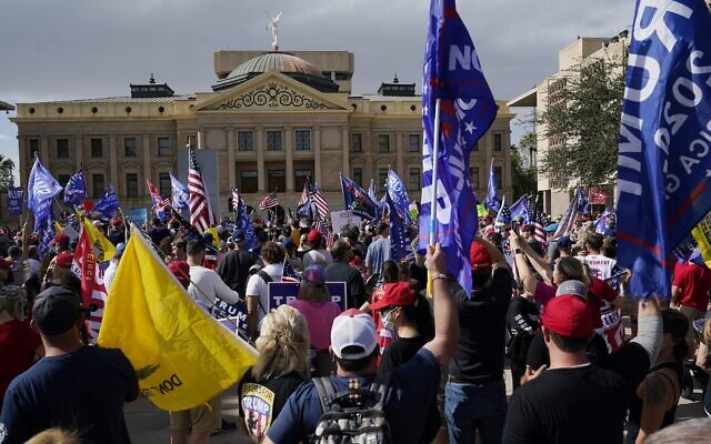 Supporters of US President Donald Trump rally outside the Arizona state capitol on November 7, 2020, in Phoenix. (AP Photo/Ross D. Franklin)
