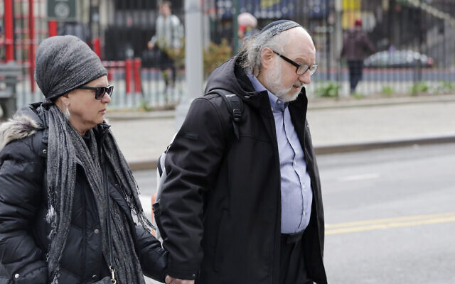 Convicted spy Jonathan Pollard and his wife, Esther, enter federal court in New York on April 7, 2016. (AP Photo/Mark Lennihan)