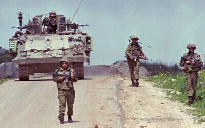 Israeli soldiers patrol a road in Israeli-controlled southern Lebanon, March 31, 1996. (AP Photo/Yaron Kaminsky/File)