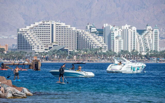 People enjoy the beach in the resort city of Eilat, on November 6, 2020. (Yossi Aloni/Flash90)