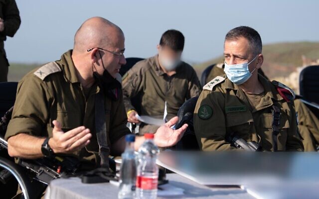 IDF Chief of Staff Aviv Kohavi, right, speaks with the head of the 210th 'Bashan' Division overlooking the Syrian border on November 29, 2020. (Israel Defense Forces)