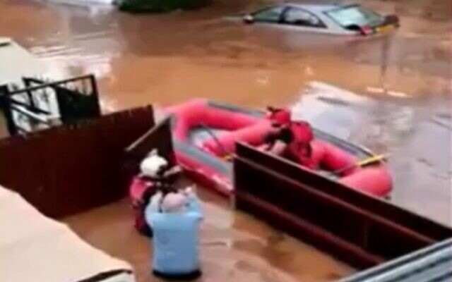 Resident is rescued after their home floods in Ness Ziona, November 21, 2020 (Screen grab/Channel 12)