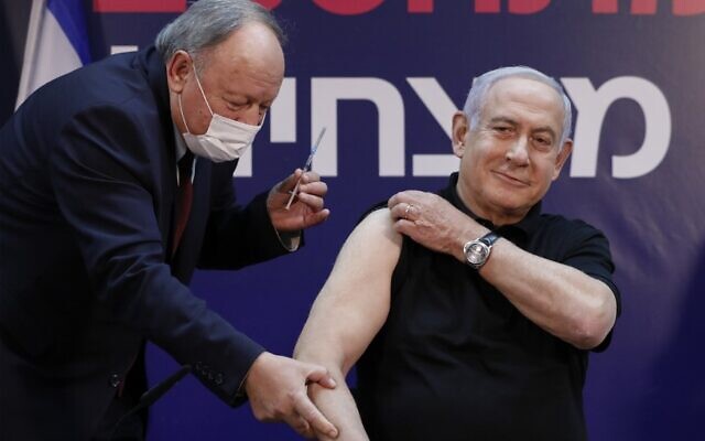 Prime Minister Benjamin Netanyahu receives a coronavirus vaccine at Sheba Medical Center in Ramat Gan, on December 19, 2020, becoming the first Israeli to get the vaccine (AMIR COHEN / POOL / AFP)