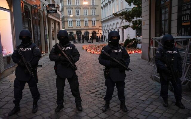 Armed police officers stand guard before the arrival of Austrian Chancellor Kurz and the president of the European Council to pay respects to the victims of the terrorist attack in Vienna, Austria, November 9, 2020. (Joe Klamar/AFP)