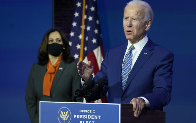 US President-elect Joe Biden, joined by Vice President-elect Kamala Harris, speaks at The Queen theater, Monday, Nov. 9, 2020, in Wilmington, Del. (AP Photo/Carolyn Kaster)