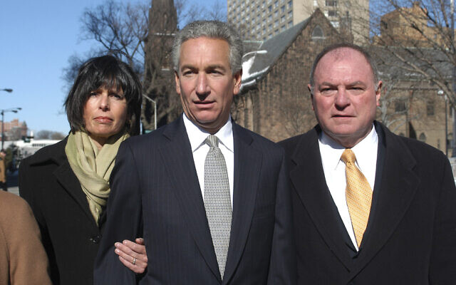 In this March 4, 2005 file photo, Charles B. Kushner, flanked by his wife, Seryl Beth, left, and his attorney Alfred DeCotiis arrives at the Newark Federal Court for sentencing in Newark, New Jersey (AP /Marko Georgiev)