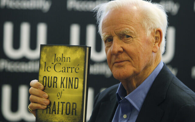 British author John le Carre holds a copy of his new book entitled ‘Our Kind of Traitor’ at a central London bookstore during a book signing event to mark the launch of the novel in London Thursday, Sept. 16, 2010. Le Carre’s real name David Cornwall who worked in the 1950’s and 60’s for British intelligence agencies most famous books centre on his spy master George Smiley character in the Smiley Trilogy. (AP Photo/Alastair Grant)