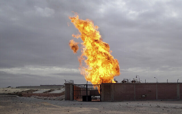 File: Flames are seen after an explosion at a gas terminal in Egypt's northern Sinai Peninsula on Saturday, Feb. 5, 2011 in El-Arish (AP Photo/Ashraf Swailem)