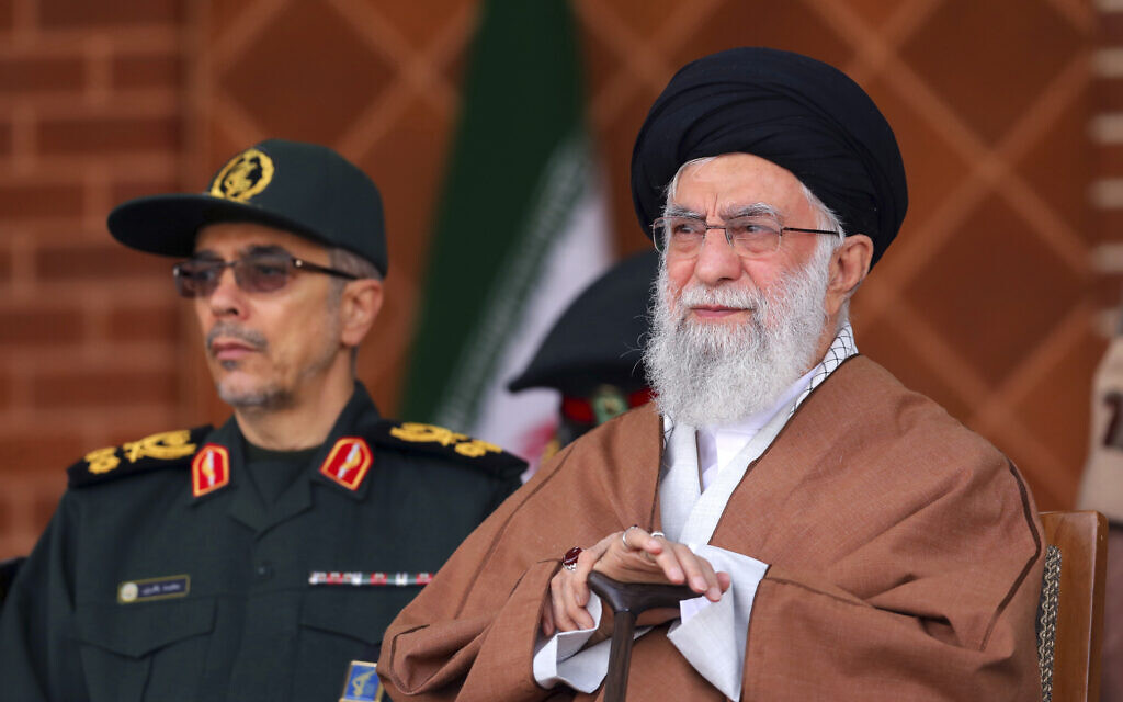 In this picture released by an official website of the office of the Iranian supreme leader, Supreme Leader Ayatollah Ali Khamenei, right, reviews armed forces with Chief of the General Staff of the Armed Forces Gen. Mohammad Hossein Bagheri, during a graduation ceremony at Iran's Air Defense Academy, in Tehran, Iran, October 30, 2019. (Office of the Iranian Supreme Leader via AP)