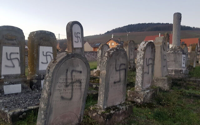 Tombs tagged with swastikas are pictured in a Jewish cemetery in Westhoffen, eastern France, December 3, 2019. (AP Photo)