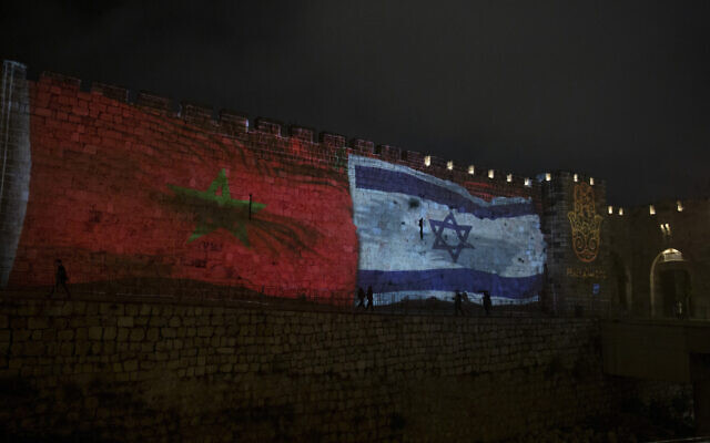 The national flags of Israel and Morocco are projected on the walls of the Old City of Jerusalem, December 23, 2020. (AP Photo/Maya Alleruzzo)