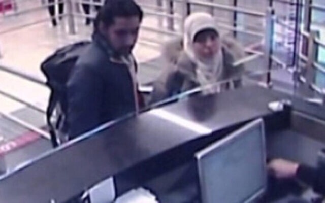 This security camera video footage shows Hayat Boumeddiene, and a male travel companion arriving at Istanbul's Sabiha Gokcen airport on Jan. 2, 2015. Boumeddiene, the widow of a gunman who attacked a kosher supermarket and a police officer, killing five people before he died in a raid by security forces, was jailed for 30 years in absentia on December 16, 2020. She is still on the run. (AP Photo/Haberturk Television, File)