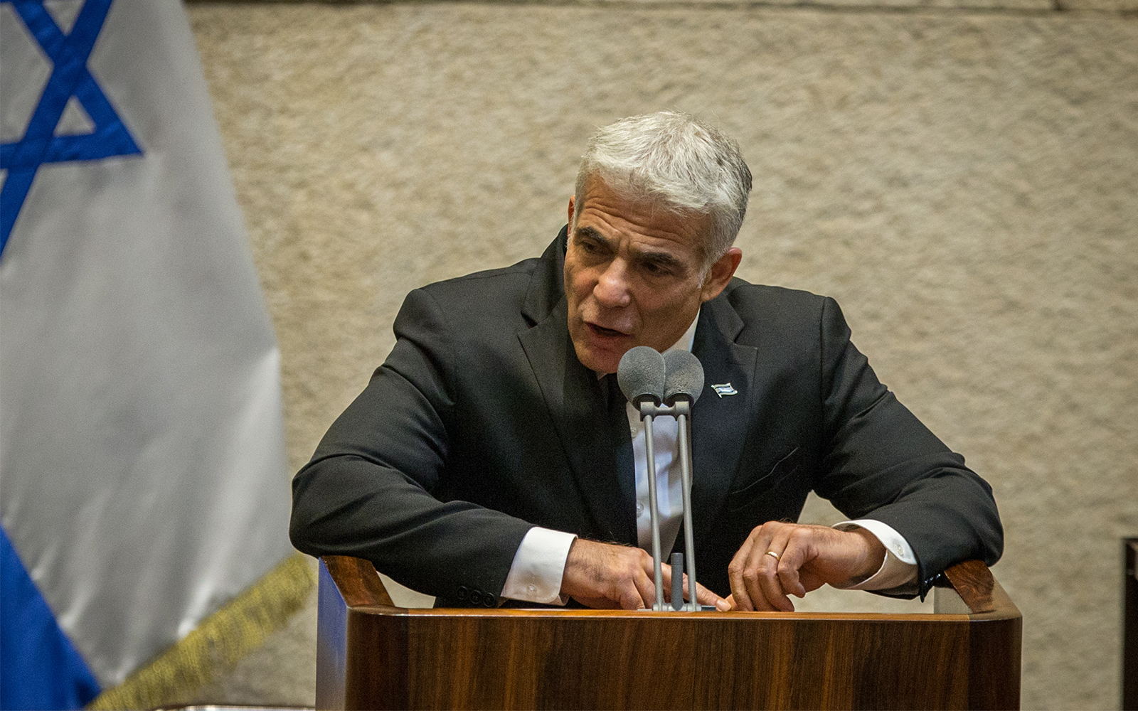 MK Yair Lapid speaks at the Knesset in Jerusalem, August 24, 2020. (Oren Ben Hakoon/POOL)