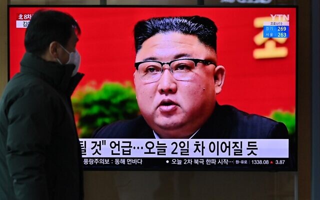 A man watches a television screen showing news footage of North Korean leader Kim Jong Un attending the 8th congress of the ruling Workers' Party held in Pyongyang, at a railway station in Seoul on January 6, 2021. (Jung Yeon-Je/AFP)