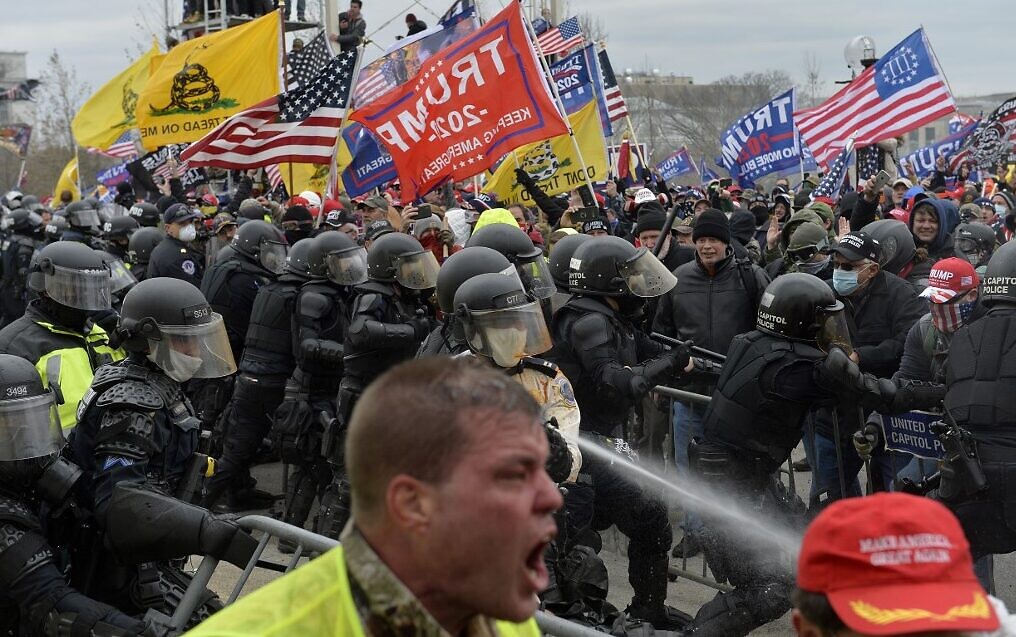 Trump supporters clash with police and security forces as they try to storm the US Capitol, in Washington on January 6, 2021. (Joseph Prezioso/AFP)