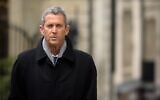 French-Israeli diamond magnate Beny Steinmetz comes back to Geneva's courthouse during his trial over allegations of corruption linked to mining deals in Guinea, on January 11, 2021, in Geneva. (Fabrice Coffrini/AFP)