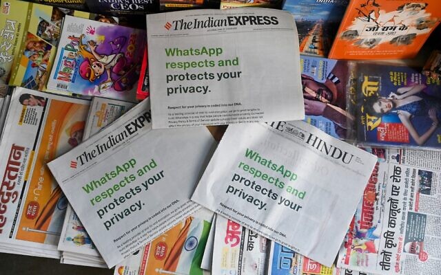 An advertisement from WhatsApp is seen in a newspaper at a stall in New Delhi on January 13, 2021. (Sajjad Hussain/AFP)