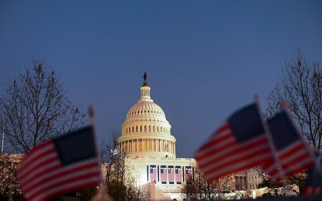 US flags seen near the Capitol Building in Washington, DC on January 19, 2021, ahead of the 59th inaugural ceremony for President-elect Joe Biden and Vice President-elect Kamala Harris. (Photo by ROBERTO SCHMIDT / AFP)