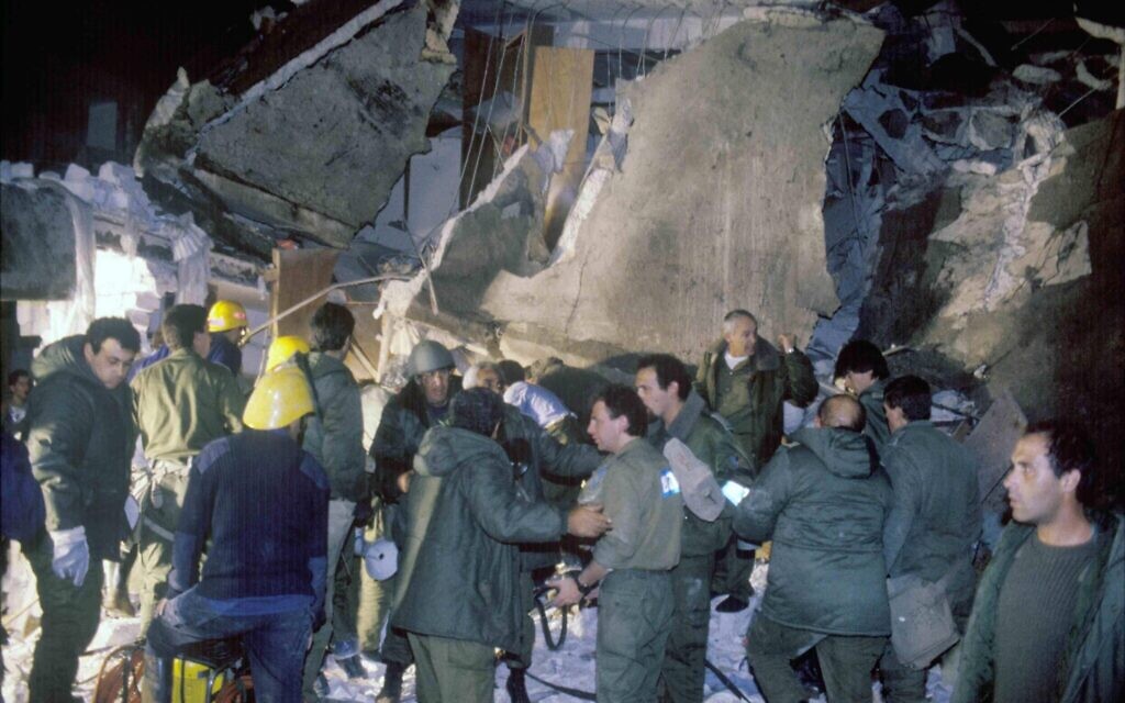Military personnel inspect a building that was hit by a Scud missile fired by Iraq during the 1991 First Gulf War. (Noam Wind/Defense Ministry Archive)
